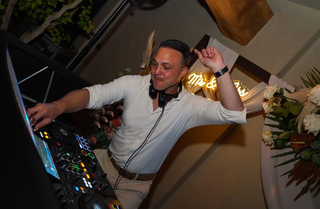 DJ behind his decks during a celebration