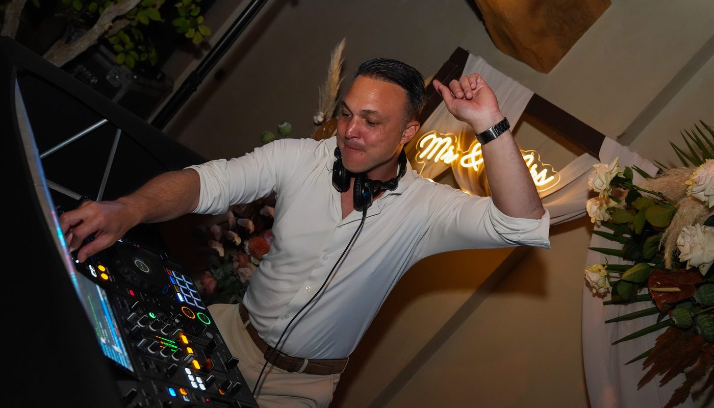 DJ behind his decks during a celebration